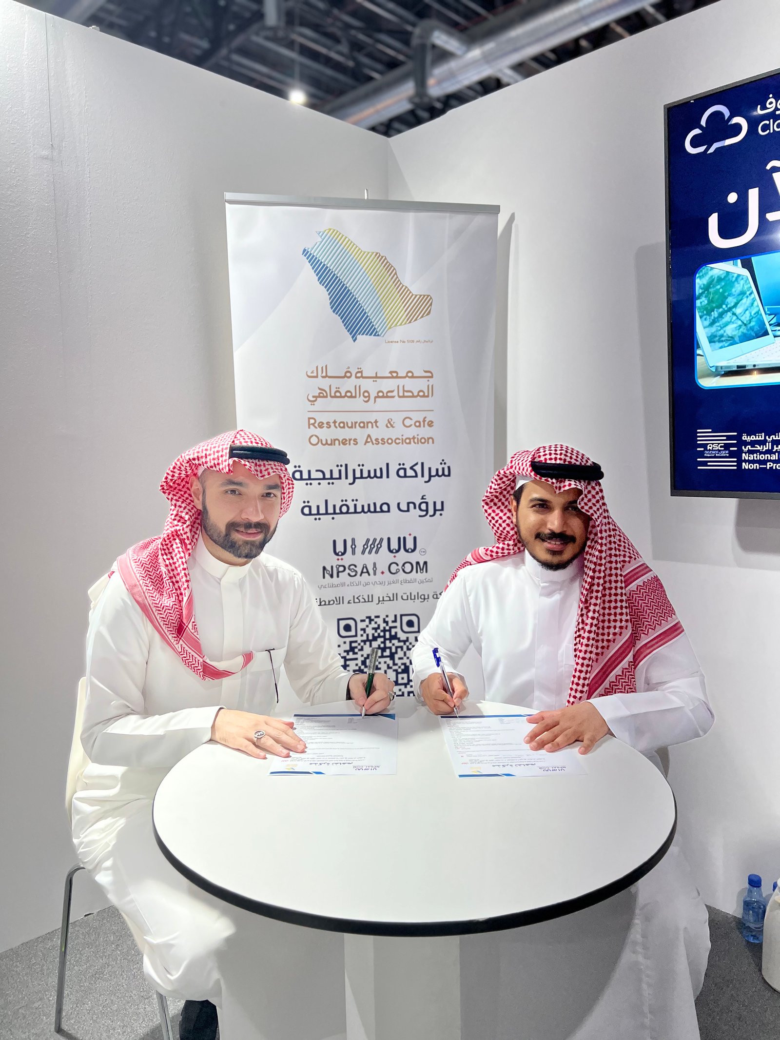 Low angle view up into a sky filled with deep blue clouds. 