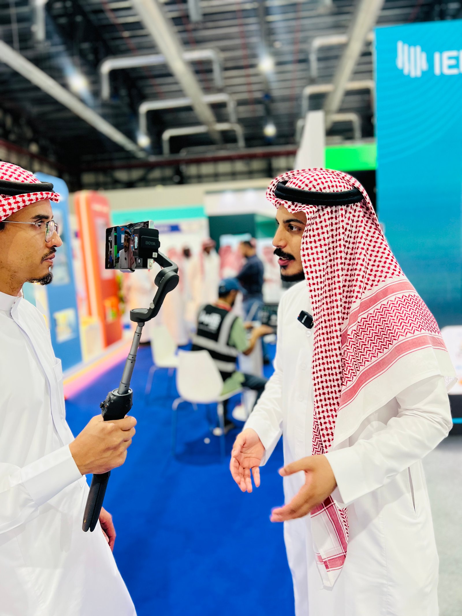 Low angle view up into a sky filled with deep blue clouds. 