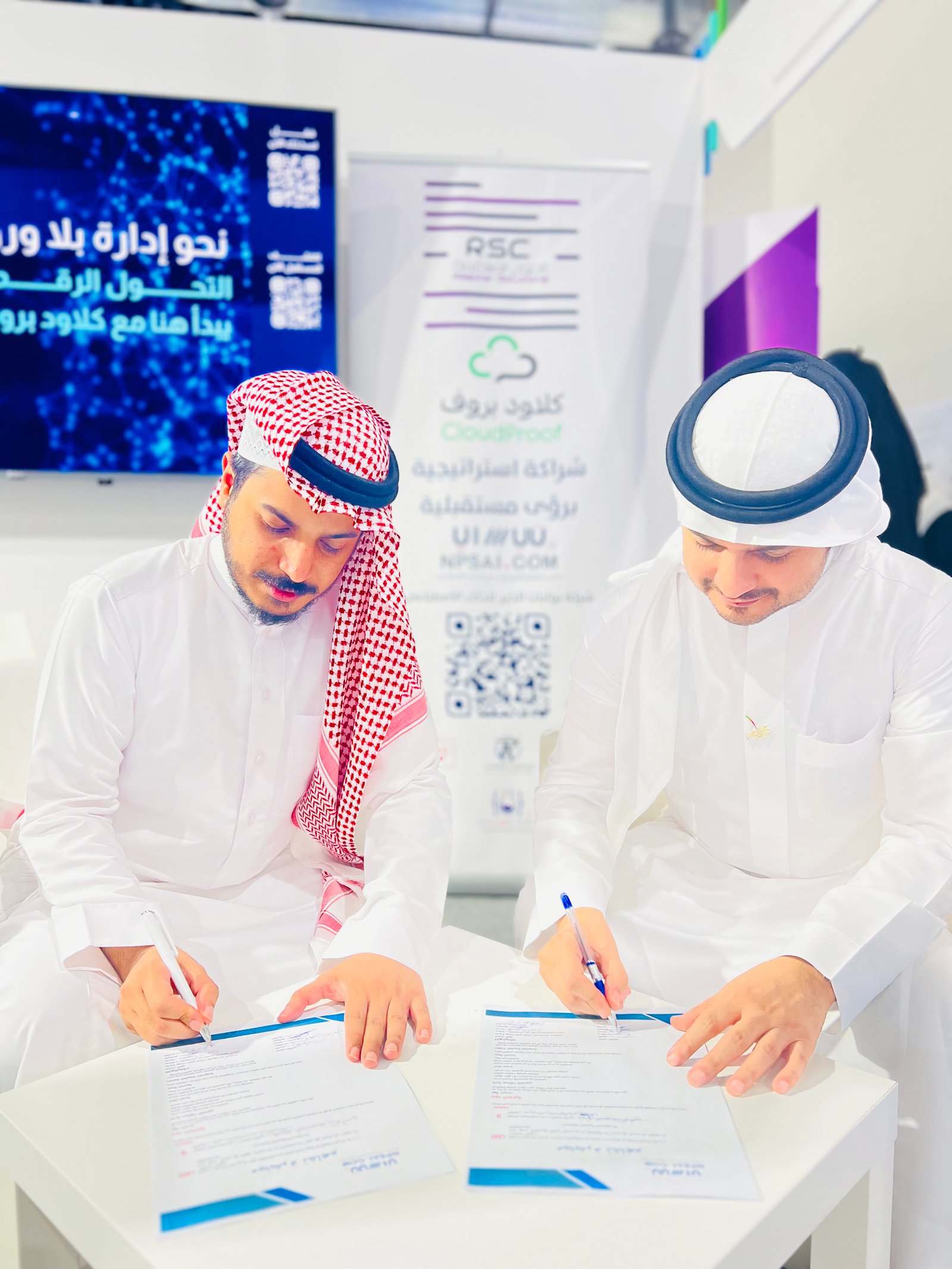 Low angle view up into a sky filled with deep blue clouds. 