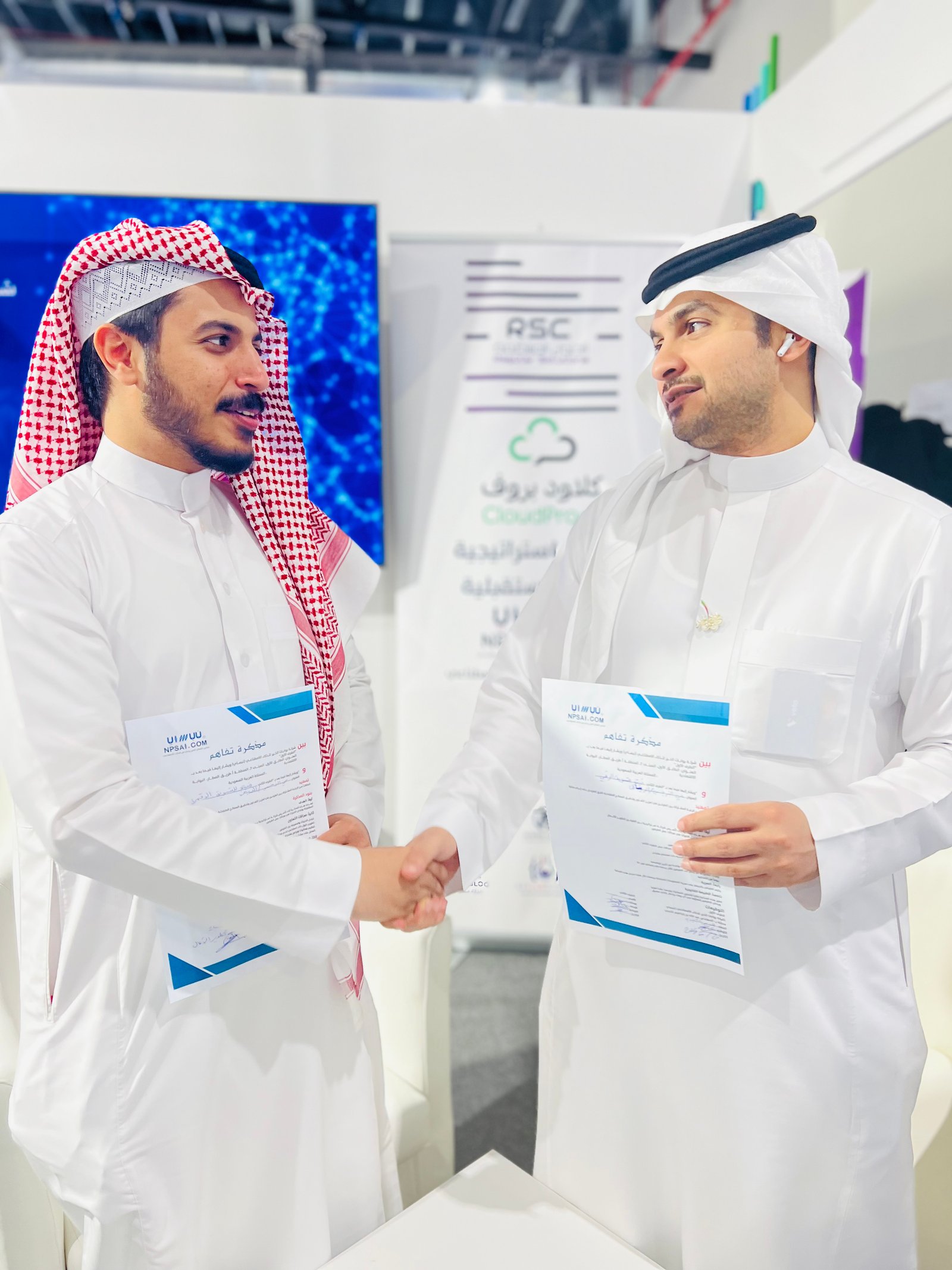 Low angle view up into a sky filled with deep blue clouds. 
